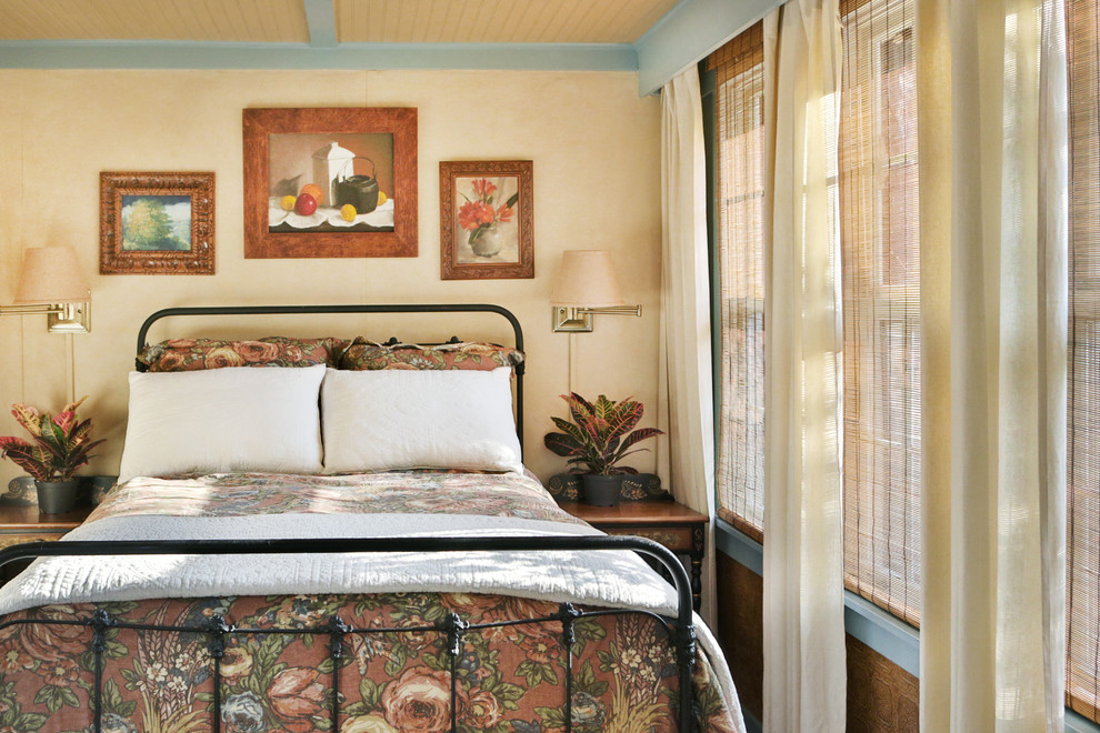 Example of a cottage bedroom design in St Louis
