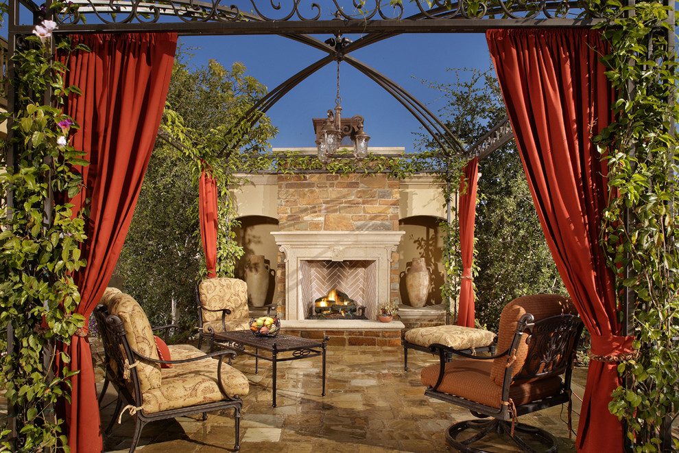 Inspiration for a mediterranean patio in Birmingham with a fire feature.