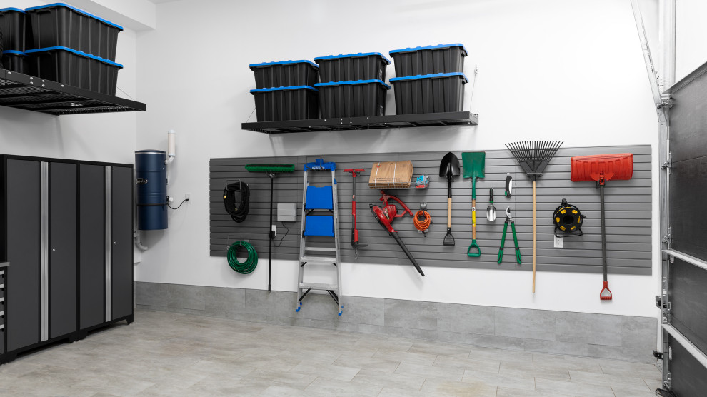 Photo of a medium sized modern detached double garage workshop in Toronto.