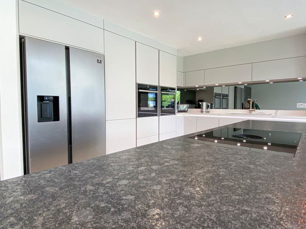 Inspiration for a large modern kitchen in Berkshire with grey cabinets and with island.