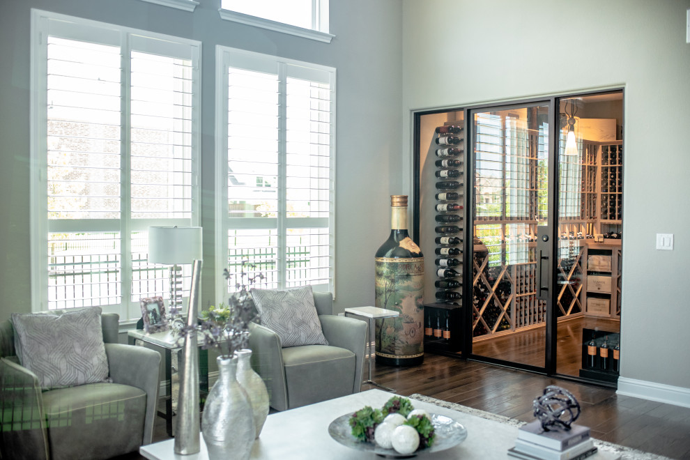 Inspiration for a mid-sized contemporary wine cellar in Dallas with display racks and brown floor.