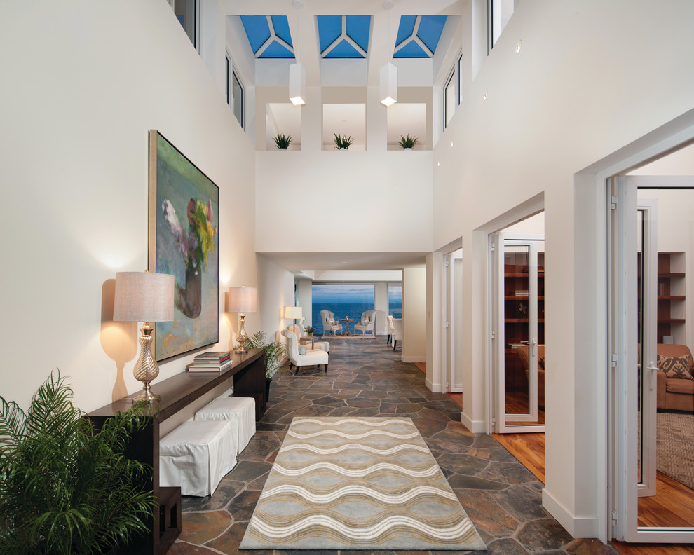 Inspiration for a transitional foyer in Orange County with white walls.