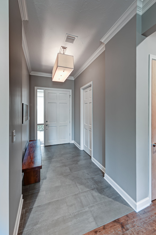 Front door - mid-sized transitional ceramic tile front door idea in Phoenix with gray walls and a white front door