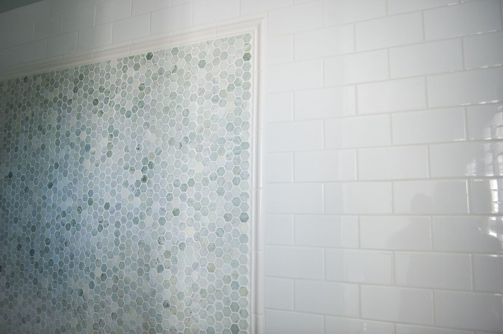 Example of a large transitional master white tile and subway tile mosaic tile floor doorless shower design in Charlotte with shaker cabinets, beige cabinets, a two-piece toilet, white walls, a drop-in sink and marble countertops
