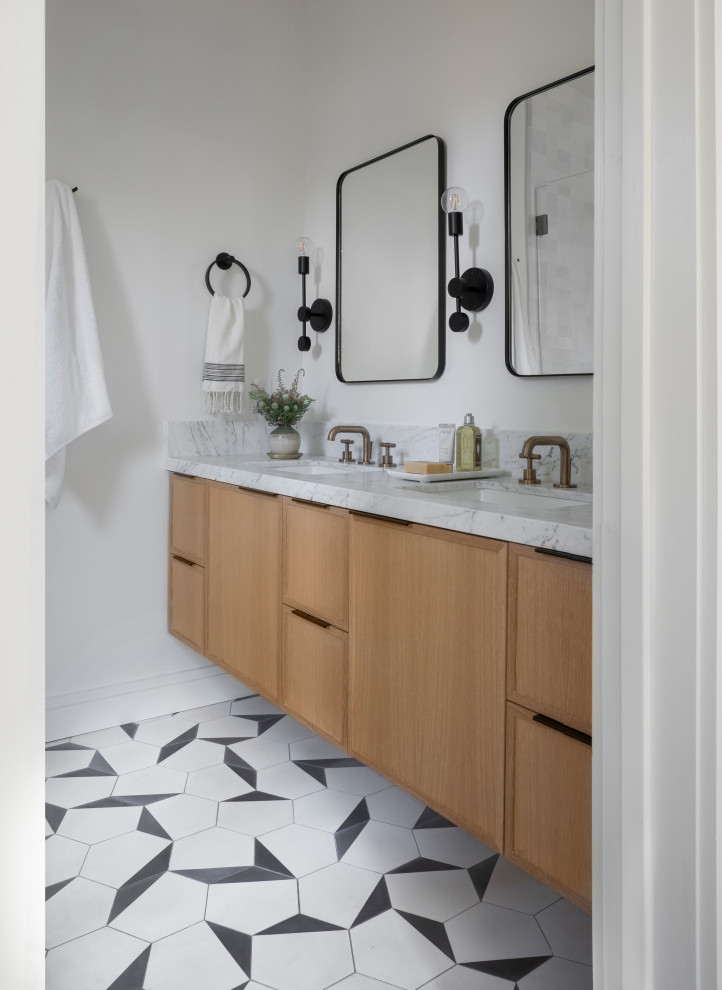 Photo of a mid-sized contemporary master bathroom in San Francisco with shaker cabinets, light wood cabinets, white tile, stone tile, cement tiles, an undermount sink, marble benchtops, white floor, white benchtops, a double vanity and a built-in vanity.