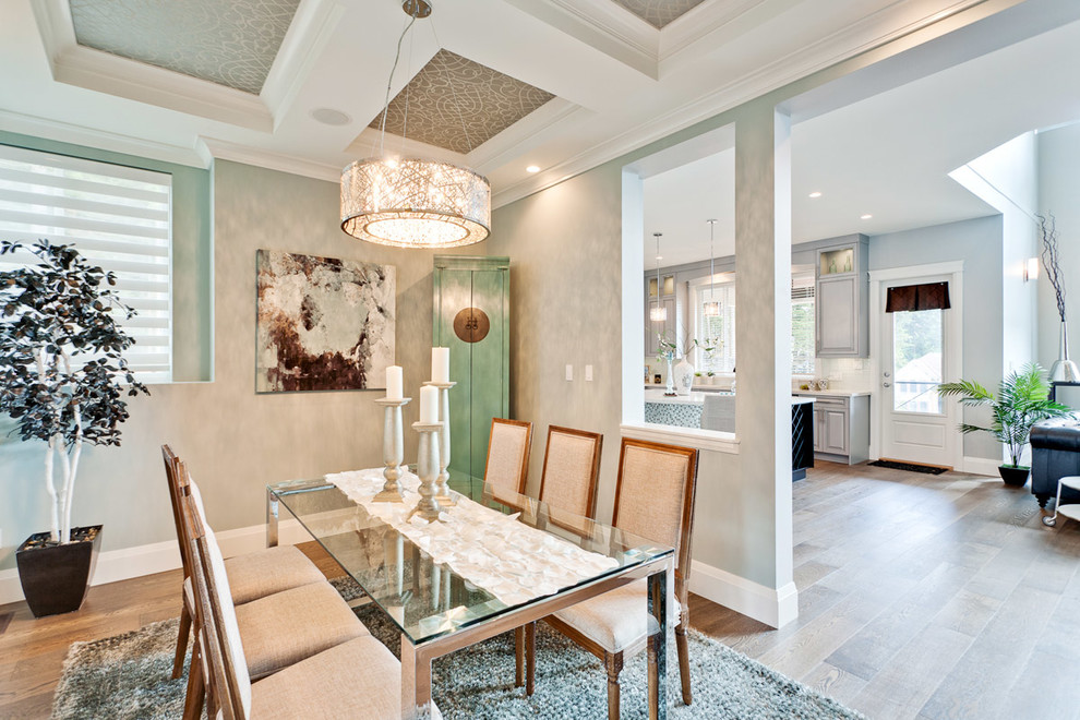Traditional open plan dining in Vancouver with multi-coloured walls, medium hardwood floors and brown floor.