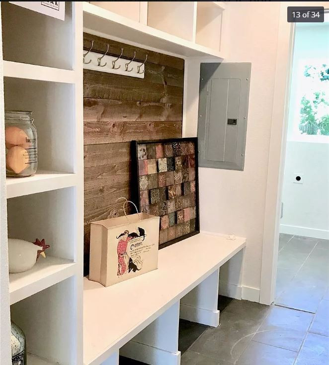 Dedicated laundry room - mid-sized traditional galley porcelain tile and gray floor dedicated laundry room idea in Denver with a farmhouse sink, brown backsplash, shiplap backsplash, white walls and a side-by-side washer/dryer