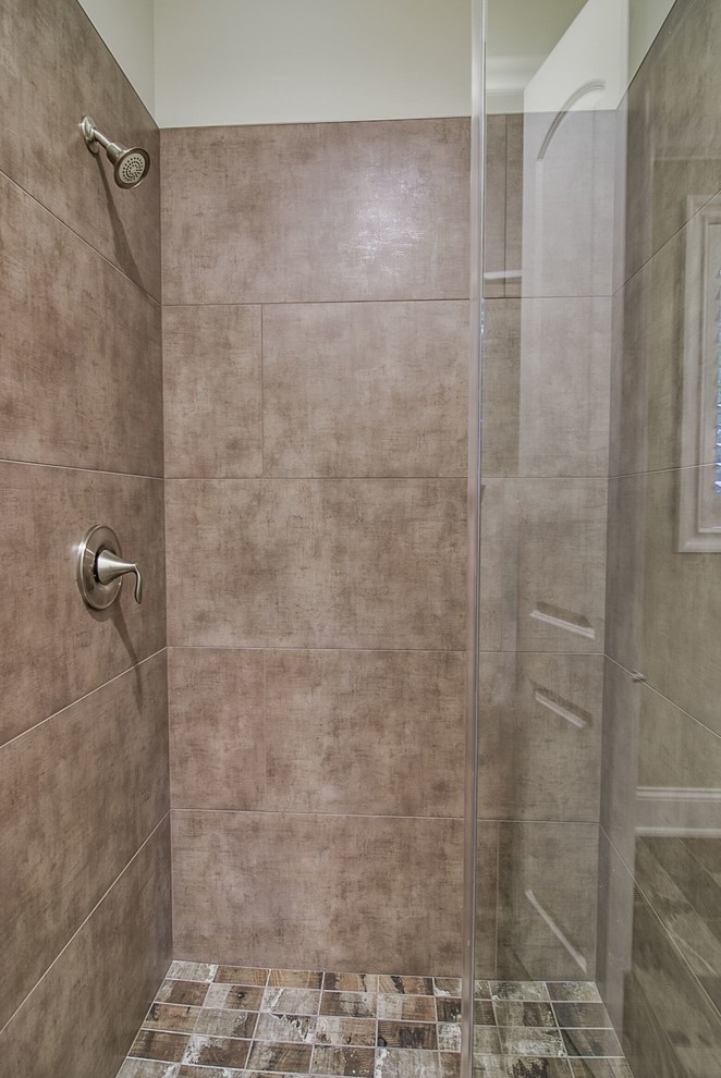 This is an example of a large modern bathroom in Chicago with stone tiles.