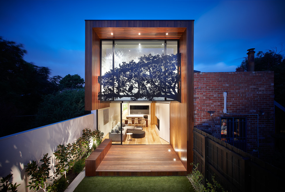 Photo of a mid-sized contemporary two-storey exterior in Melbourne with a flat roof.