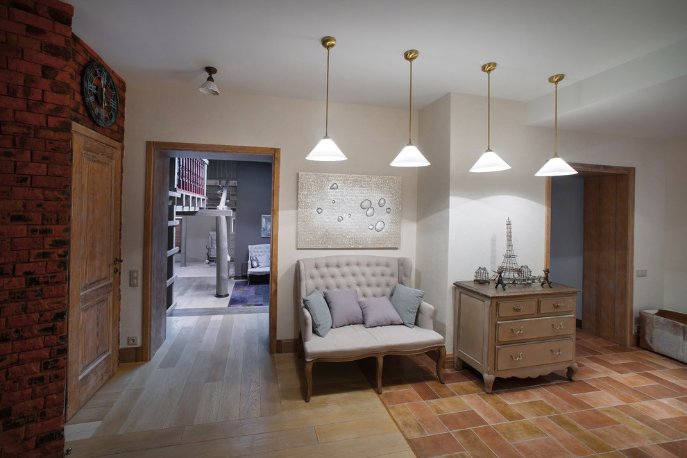 Photo of an expansive rural foyer in Moscow with white walls, porcelain flooring, a double front door, a dark wood front door and beige floors.