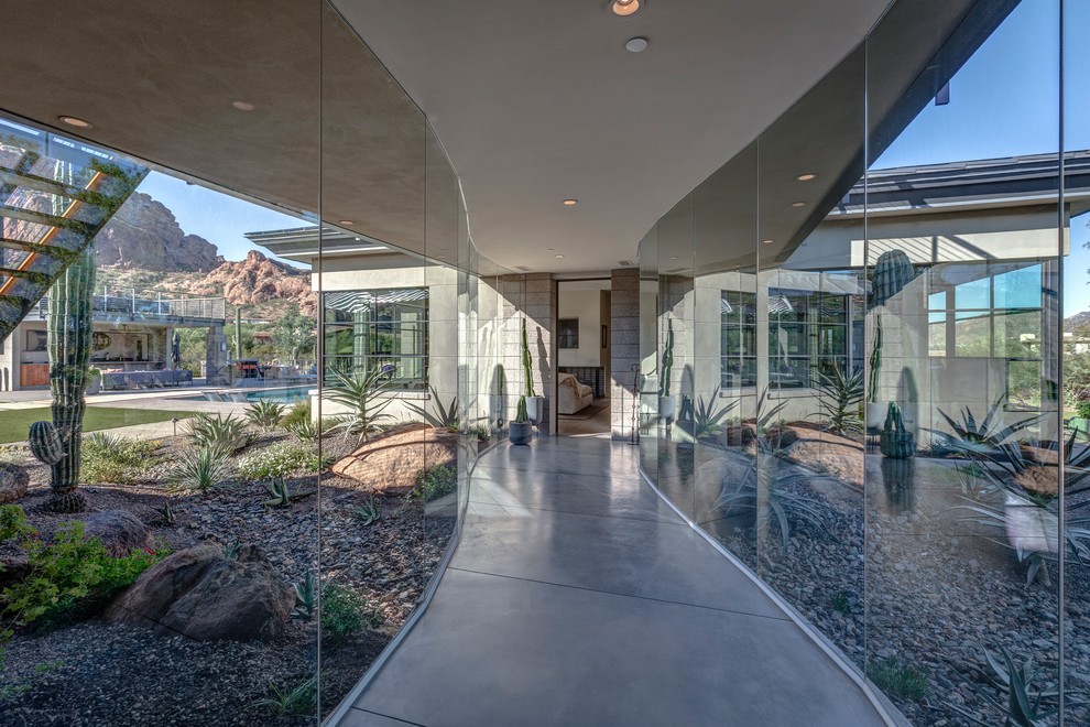 Trendy concrete floor and gray floor hallway photo in Phoenix