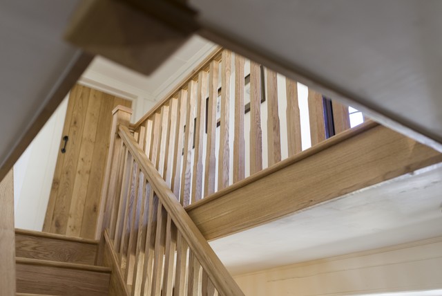 New solid oak staircase in North Dorset, England. Including bespoke bookcase. traditional-staircase