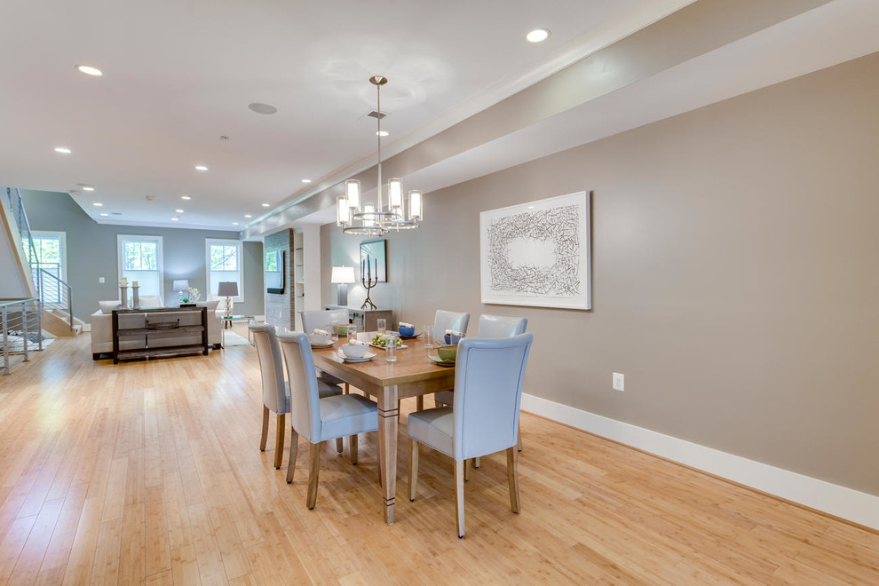 Design ideas for a mid-sized modern open plan dining in DC Metro with beige walls, bamboo floors and no fireplace.