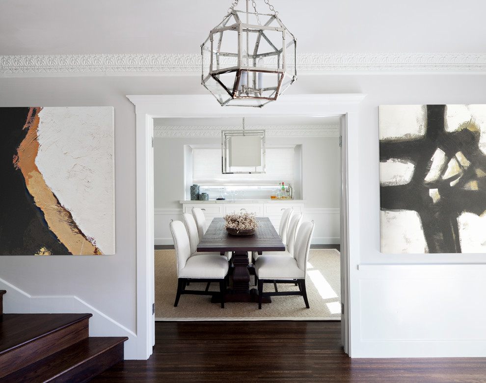 Inspiration for a mid-sized contemporary foyer in San Francisco with grey walls, medium hardwood floors, a double front door, a metal front door and brown floor.