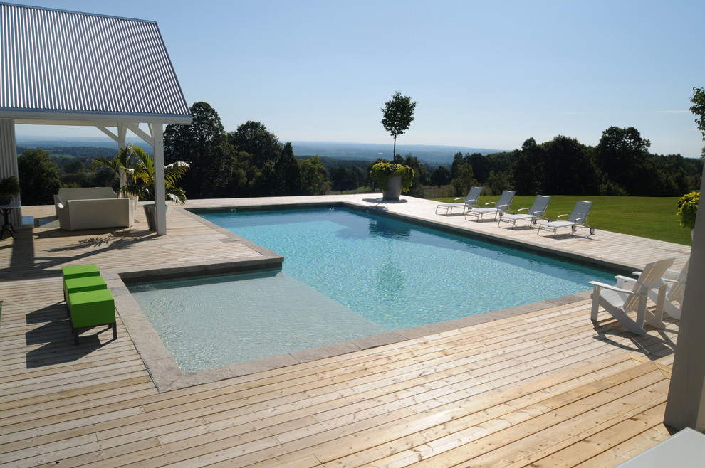 Design ideas for a modern rectangular pool in Toronto with decking.