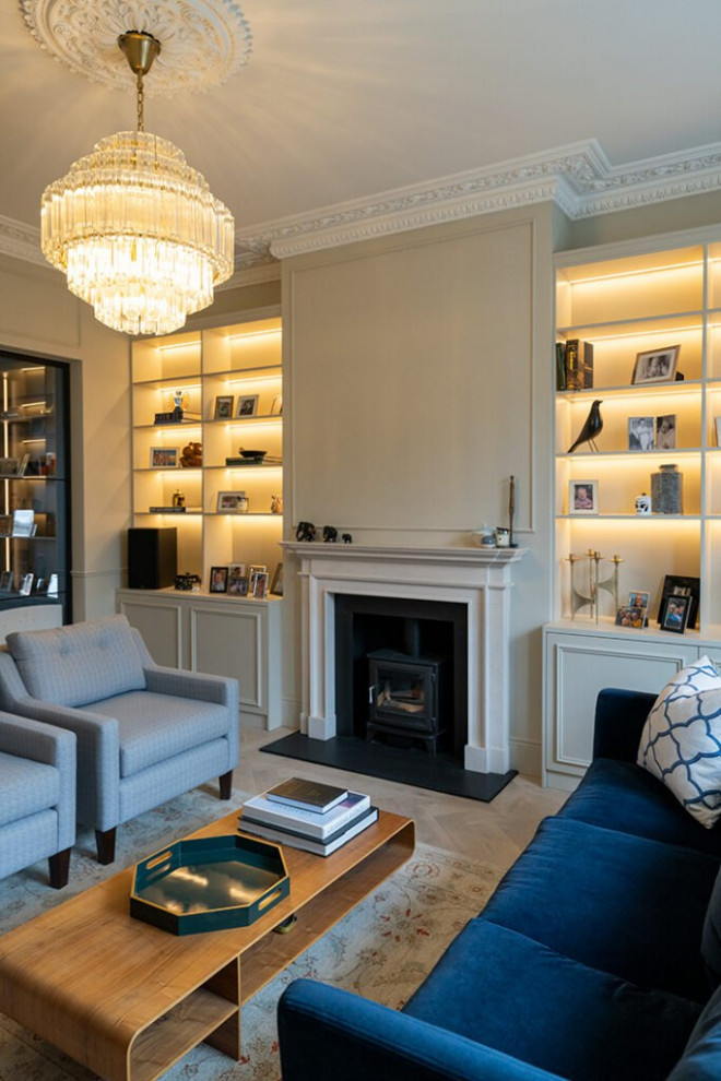 This is an example of a large contemporary formal enclosed living room in London with multi-coloured walls, vinyl floors, a standard fireplace, a concrete fireplace surround, a built-in media wall, beige floor, wood and decorative wall panelling.