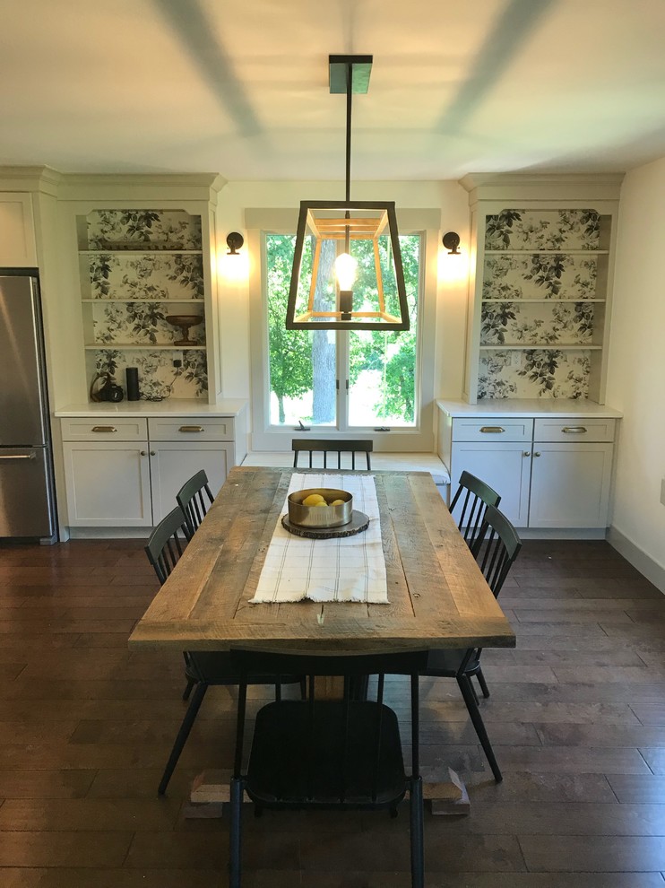 Inspiration for a large transitional galley dark wood floor and brown floor eat-in kitchen remodel in Chicago with a farmhouse sink, shaker cabinets, beige cabinets, quartz countertops, white backsplash, subway tile backsplash, stainless steel appliances, an island and white countertops