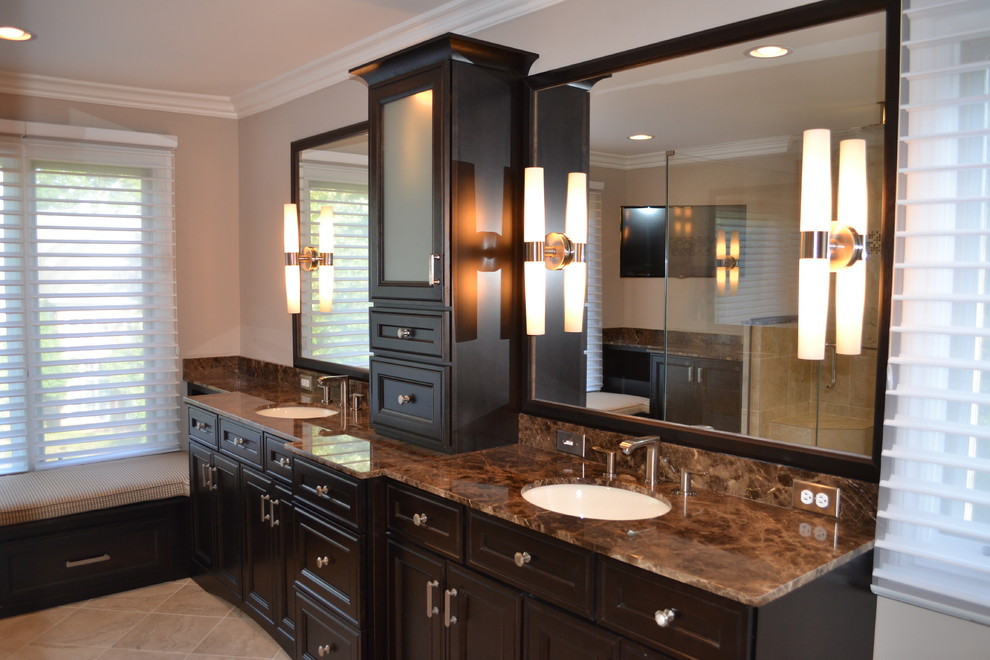 Design ideas for a large transitional master bathroom with an undermount sink, raised-panel cabinets, dark wood cabinets, marble benchtops, a double shower, a two-piece toilet, beige tile, stone tile, beige walls and porcelain floors.