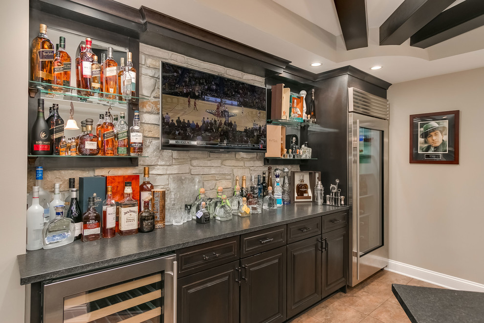 Expansive transitional home bar in Chicago with dark hardwood floors and brown floor.