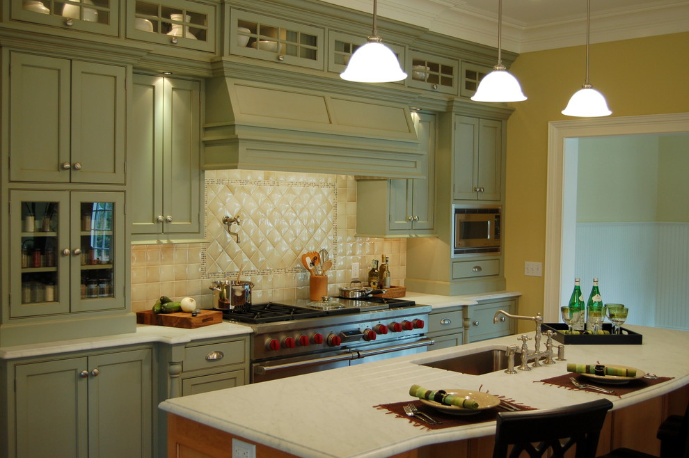 This is an example of a mid-sized traditional kitchen in New York with a single-bowl sink, shaker cabinets, blue cabinets, marble benchtops, beige splashback, ceramic splashback and with island.