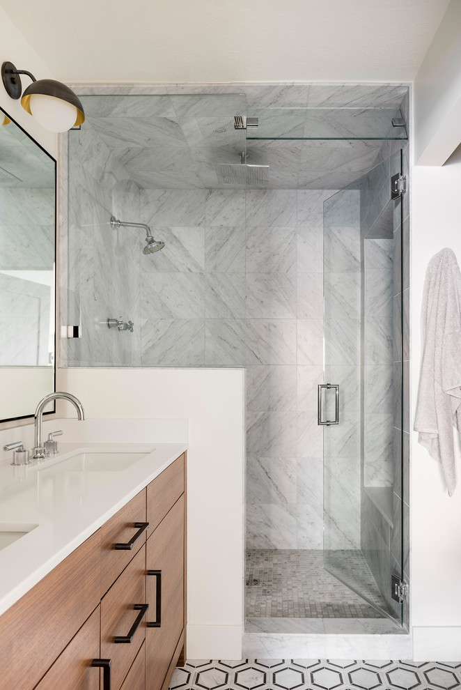 Design ideas for a mid-sized modern master bathroom in Other with flat-panel cabinets, dark wood cabinets, an open shower, a one-piece toilet, gray tile, marble, white walls, marble floors, engineered quartz benchtops, black floor, a hinged shower door, white benchtops and an undermount sink.