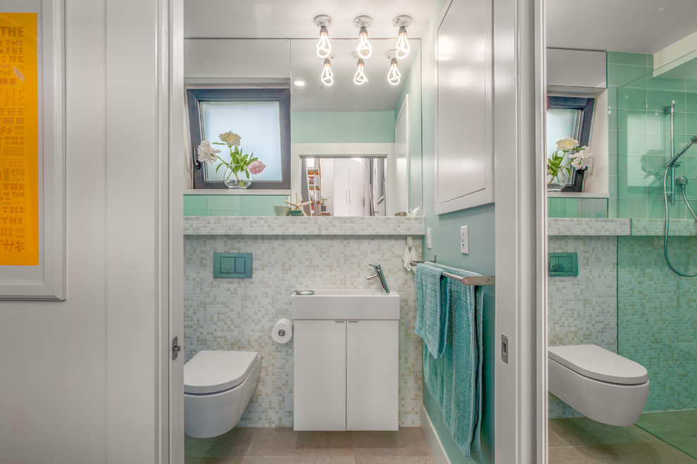 This is an example of a mid-sized contemporary master bathroom in Vancouver with flat-panel cabinets, white cabinets, a curbless shower, a one-piece toilet, multi-coloured tile, mosaic tile, blue walls, concrete floors, a drop-in sink, engineered quartz benchtops, grey floor, an open shower and white benchtops.