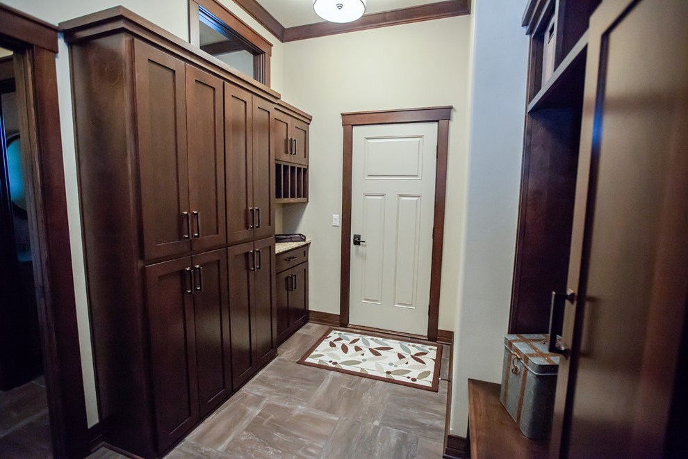 Transitional mudroom in Milwaukee with beige walls, a single front door and a white front door.