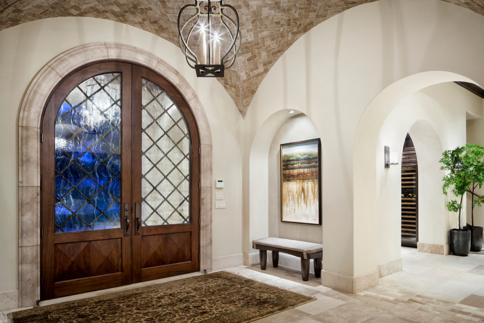 Foto de puerta principal actual de tamaño medio con paredes beige, puerta doble, puerta de madera en tonos medios, suelo beige y papel pintado