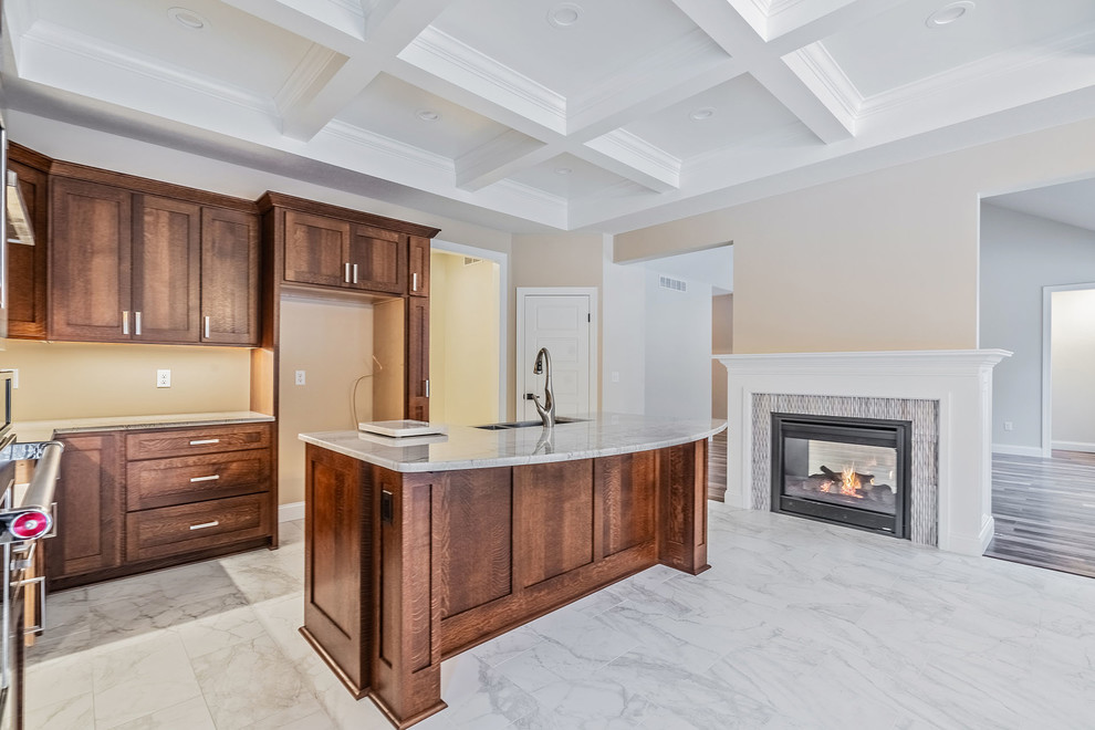 Large transitional l-shaped eat-in kitchen in New York with an undermount sink, shaker cabinets, medium wood cabinets, quartz benchtops, stainless steel appliances, ceramic floors, with island, multi-coloured floor and multi-coloured benchtop.