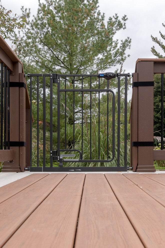 Inspiration for a mid-sized transitional backyard deck remodel with no cover