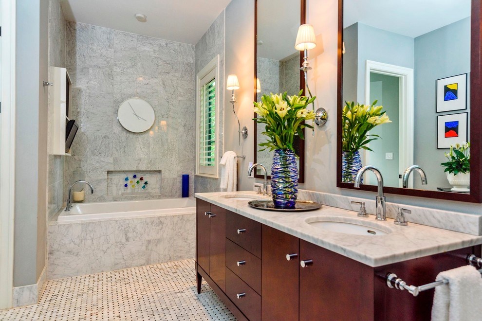Mid-sized mediterranean master bathroom in DC Metro with flat-panel cabinets, medium wood cabinets, a drop-in tub, an alcove shower, a two-piece toilet, white tile, marble, grey walls, mosaic tile floors, an undermount sink, marble benchtops, multi-coloured floor and a hinged shower door.