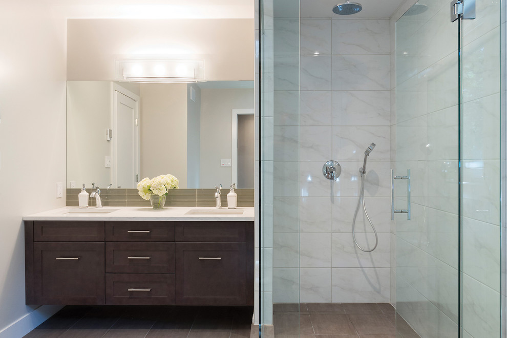 Large modern master bathroom in Other with an undermount sink, shaker cabinets, dark wood cabinets, brown tile, beige walls, a corner shower, ceramic tile, solid surface benchtops and porcelain floors.