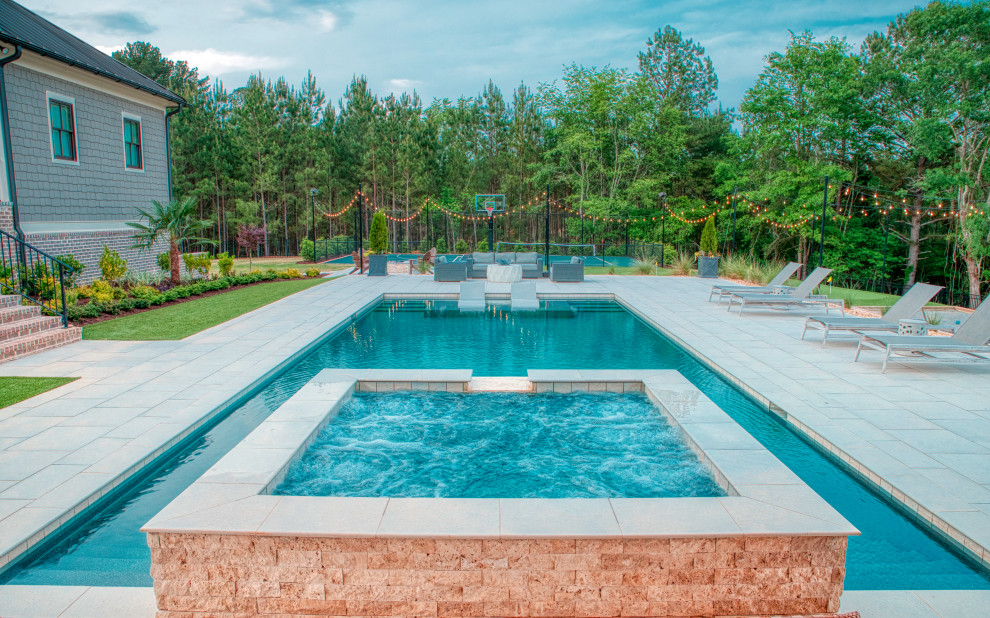 Backyard tile and rectangular hot tub photo in Atlanta