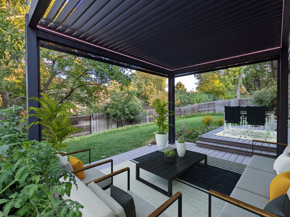 Design ideas for a large contemporary backyard patio in Denver with a pergola.