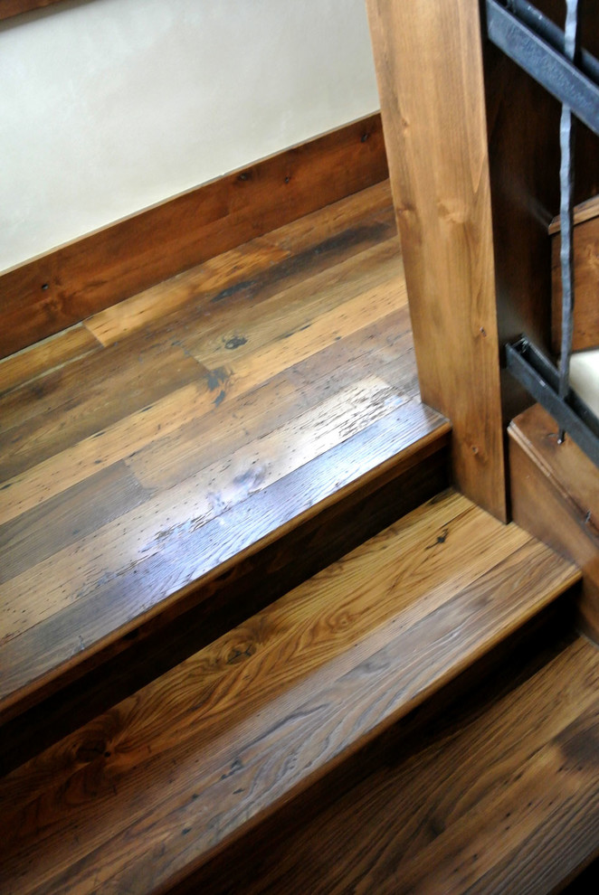 Inspiration for a large traditional wood l-shaped staircase in Cleveland with wood risers.