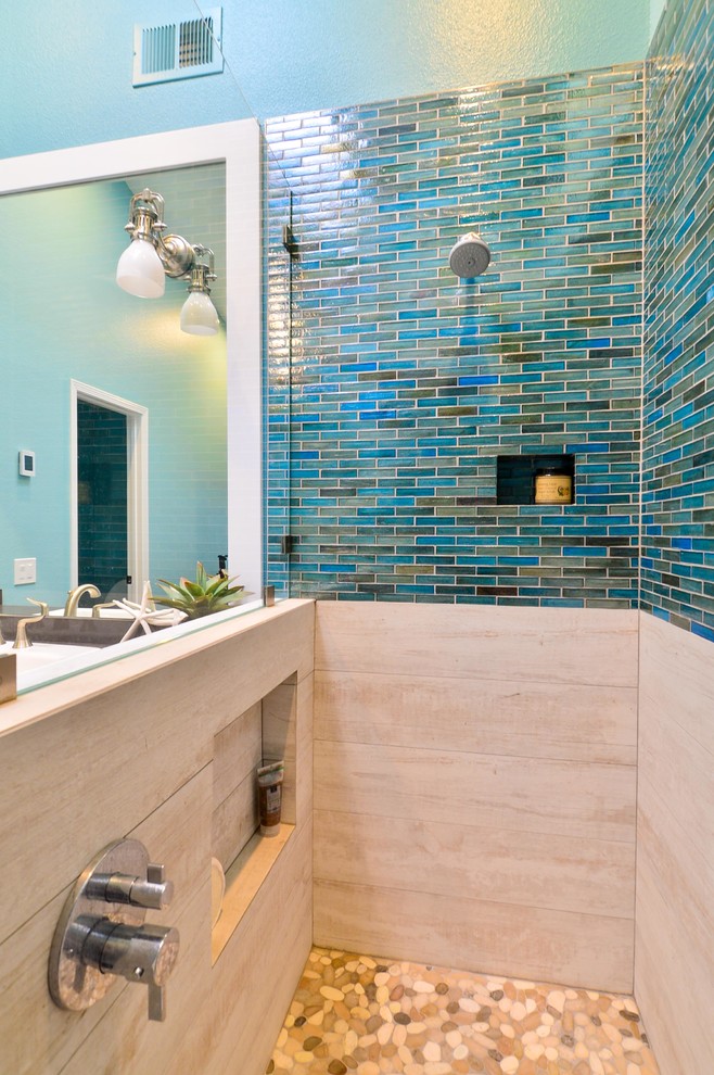 This is an example of a mid-sized beach style master bathroom in Tampa with a drop-in sink, shaker cabinets, white cabinets, engineered quartz benchtops, an open shower, blue tile, glass tile, blue walls and porcelain floors.