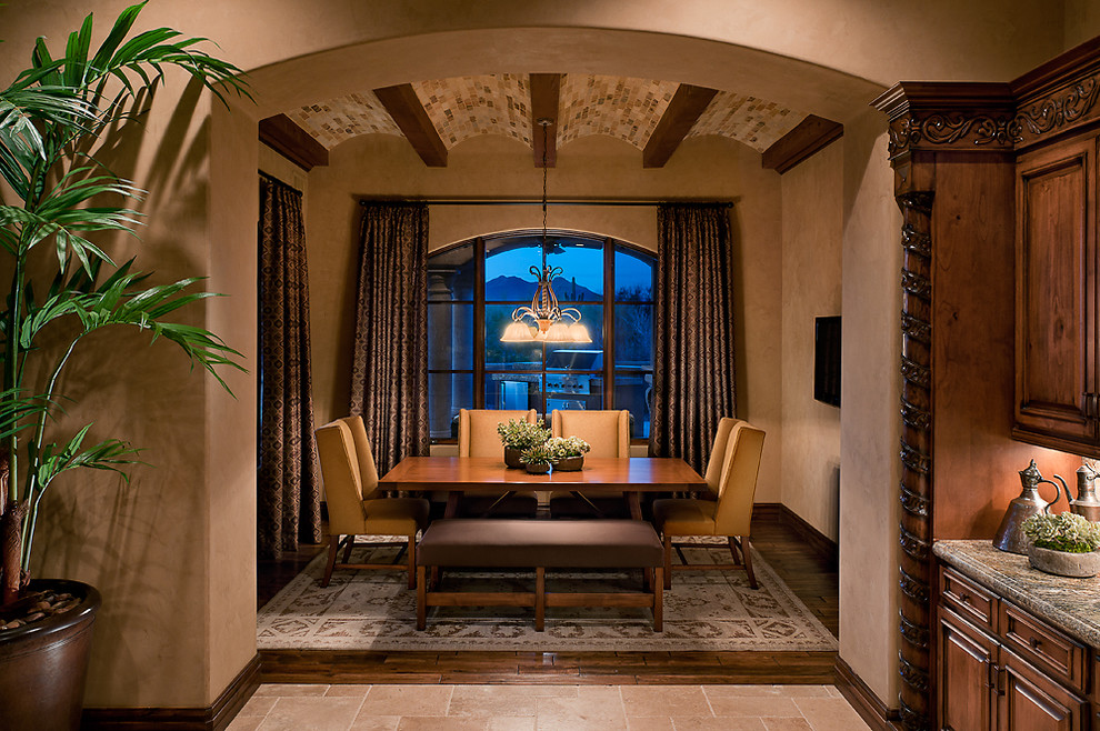 Design ideas for a traditional dining room in Phoenix with brown walls and dark hardwood floors.