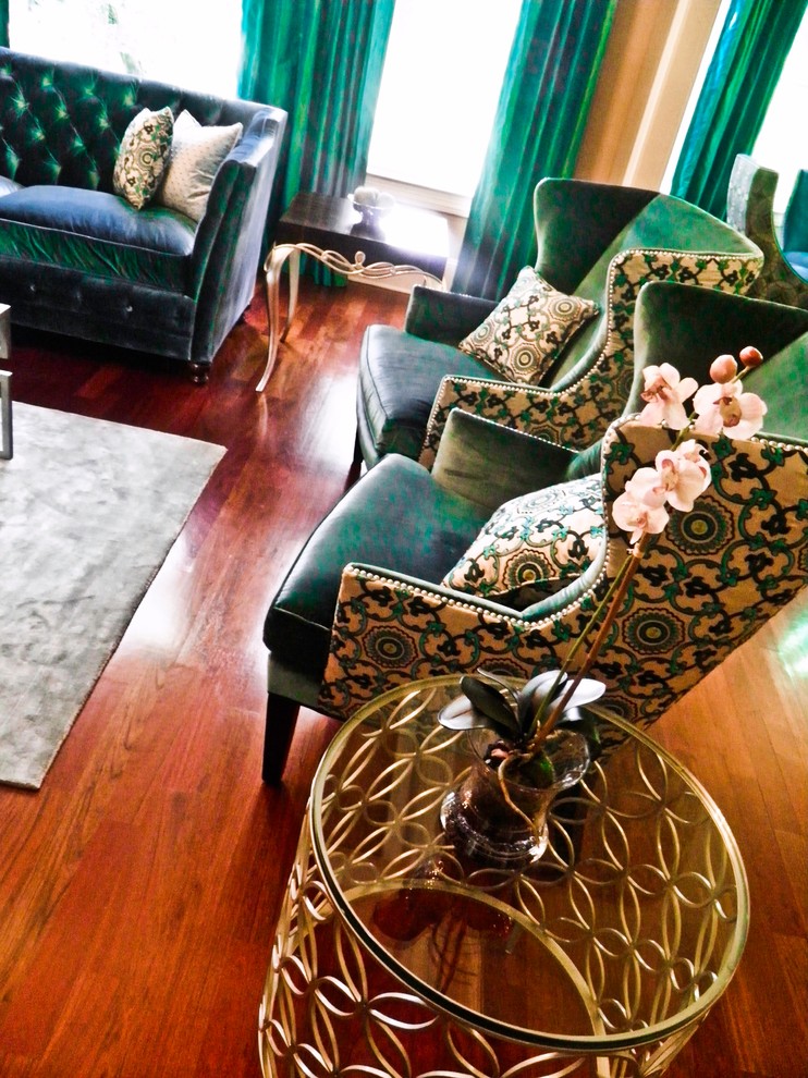 Inspiration for a mid-sized transitional enclosed medium tone wood floor and brown floor living room remodel in Atlanta with a standard fireplace and a tile fireplace