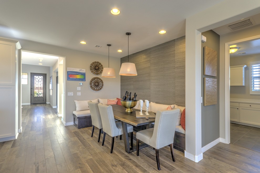 Photo of a small contemporary open plan dining in Phoenix with beige walls and porcelain floors.