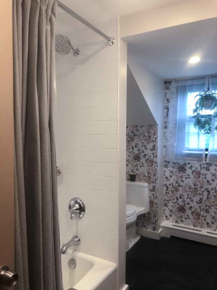 Inspiration for a mid-sized traditional bathroom in Philadelphia with open cabinets, light wood cabinets, a drop-in tub, an alcove shower, a one-piece toilet, white walls, dark hardwood floors, a vessel sink, wood benchtops, black floor, a shower curtain, a double vanity, a floating vanity and wallpaper.
