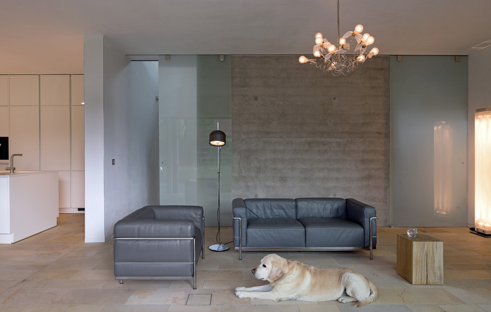Inspiration for a mid-sized contemporary formal open concept living room in Munich with travertine floors and grey walls.