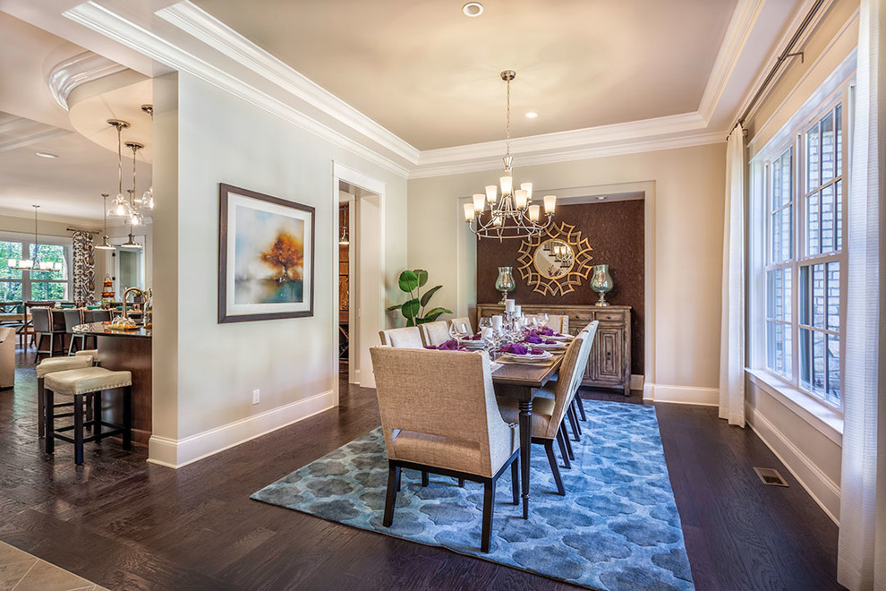 Photo of a large traditional dining room in Other with grey walls and dark hardwood floors.