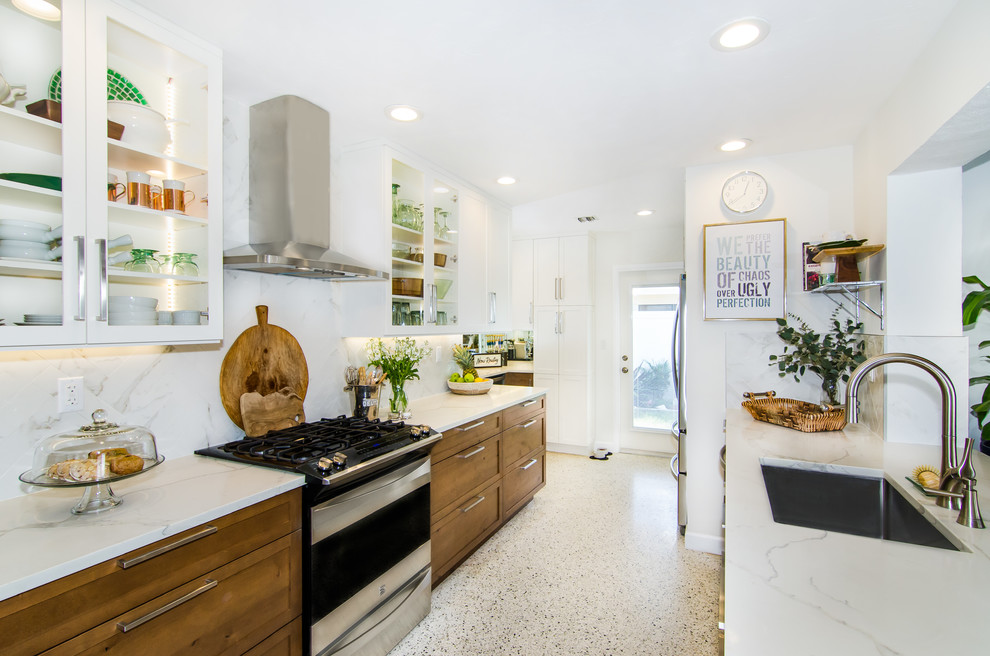 Mid-sized midcentury galley kitchen pantry in Miami with an undermount sink, shaker cabinets, medium wood cabinets, quartz benchtops, white splashback, porcelain splashback, stainless steel appliances, terrazzo floors, no island and multi-coloured floor.