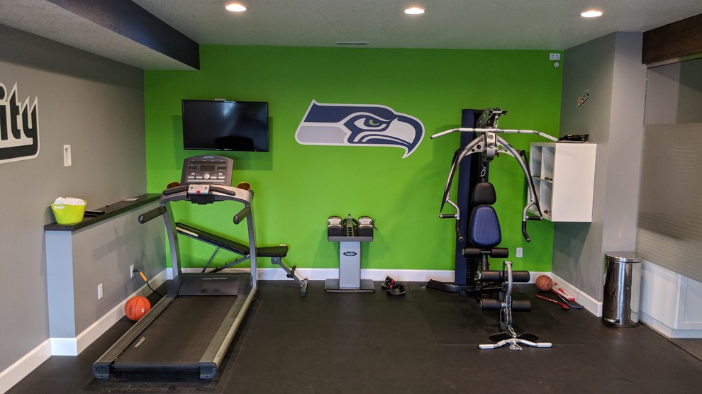 Mid-sized contemporary multipurpose gym in Portland with multi-coloured walls and black floor.