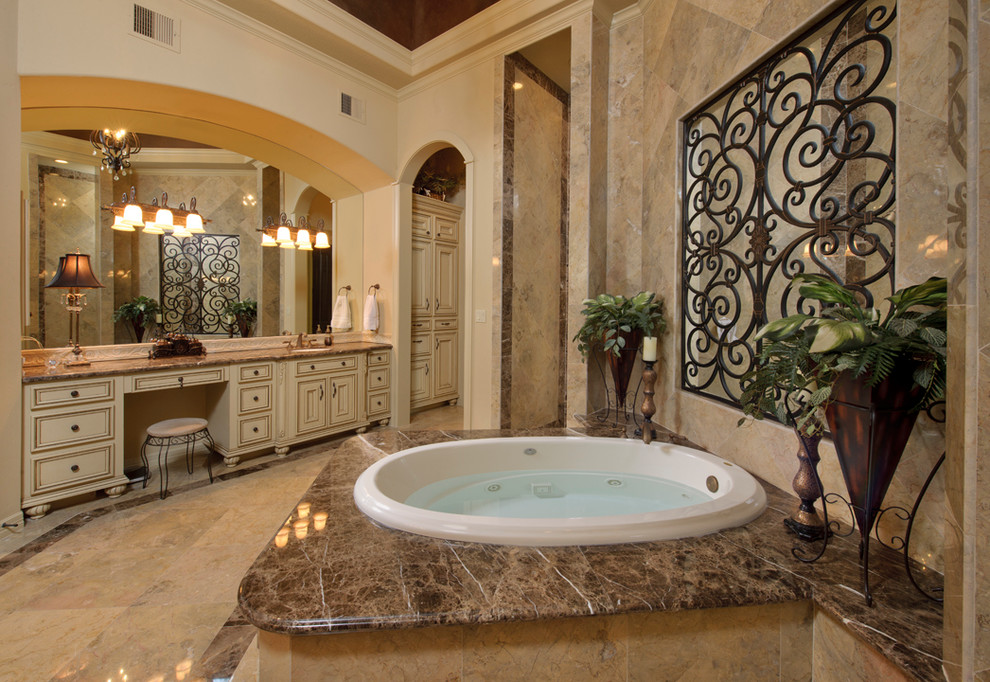 Mediterranean bathroom in Houston with a hot tub.