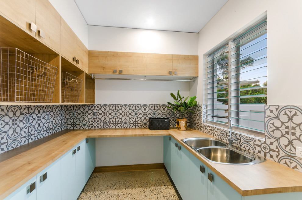 Inspiration for a beach style laundry room in Townsville.