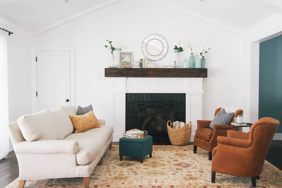 Inspiration for a mid-sized transitional enclosed living room in Salt Lake City with white walls, a standard fireplace, a brick fireplace surround and no tv.