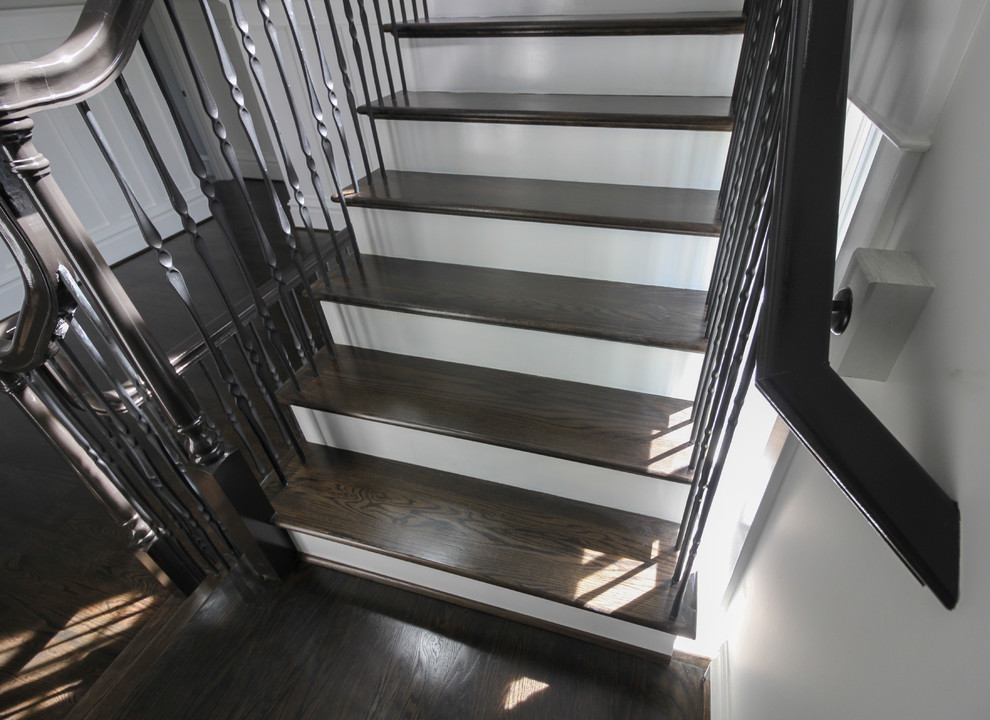 Inspiration for a large transitional wooden l-shaped mixed material railing staircase remodel in DC Metro with painted risers