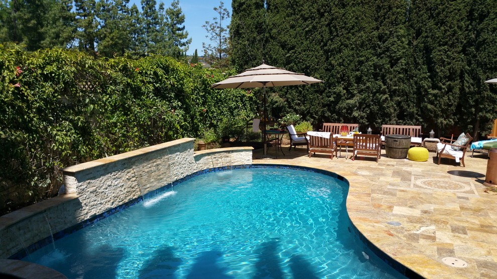 Pool fountain - mid-sized transitional backyard custom-shaped and tile pool fountain idea in San Francisco