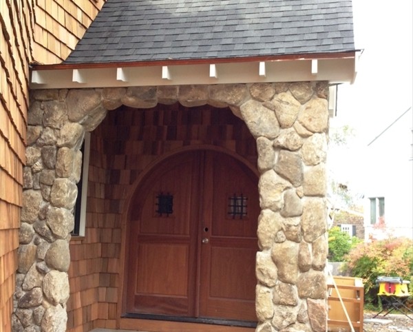Inspiration for a mid-sized rustic front door remodel in Boston with brown walls and a brown front door
